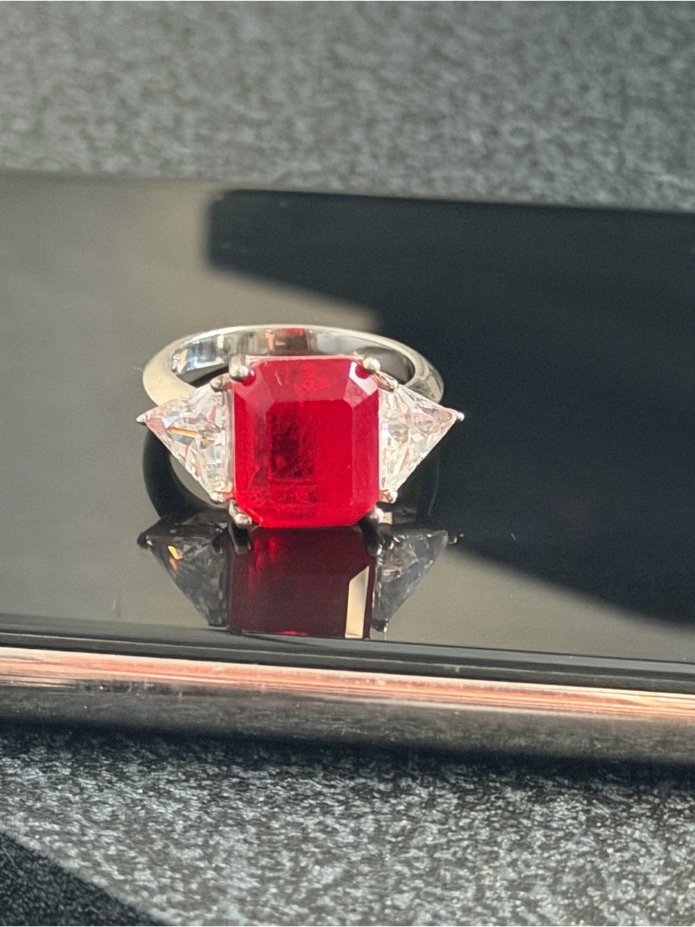 Silver Ring with Red Emerald-Cut Center Stone and Triangle Side Stones
